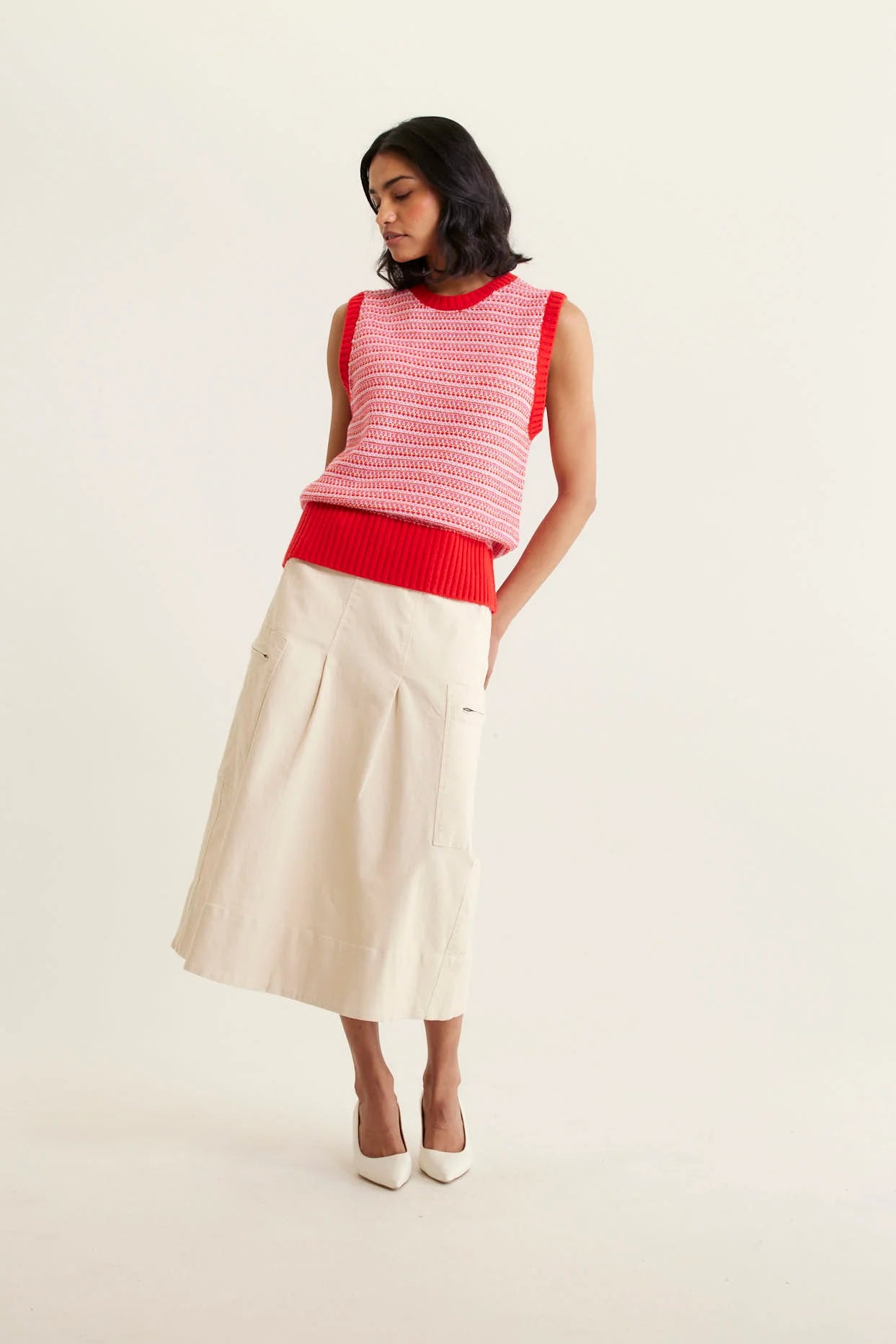 woman wearing Houston Merino Cashmere Vest - Red and beige skirt