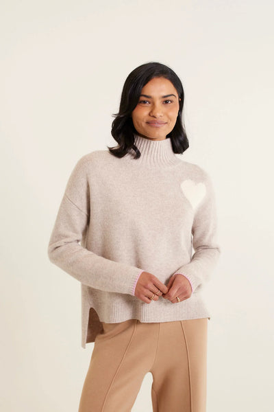 woman wearing Ronnie Merino Cashmere Polo - Beige and brown pants