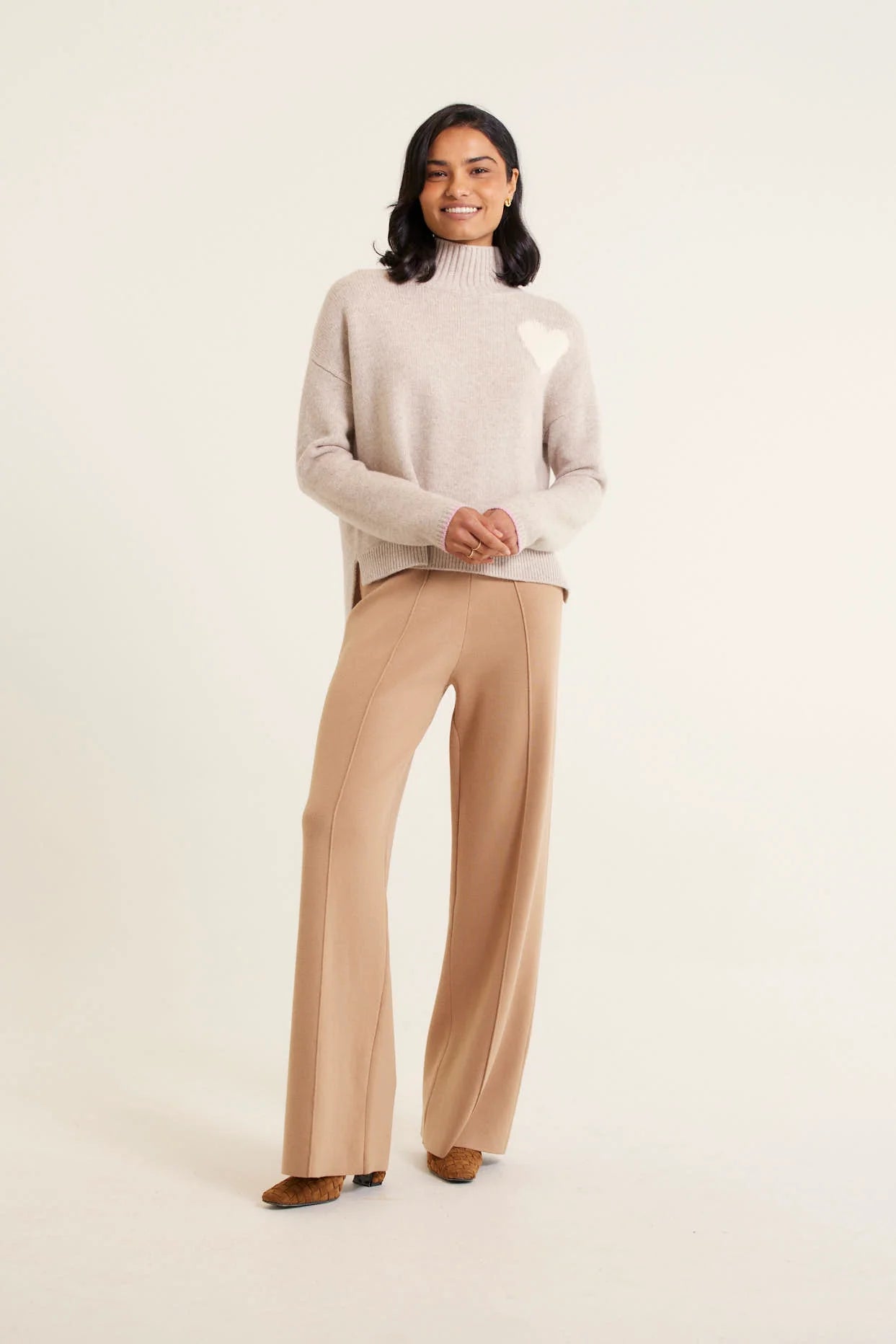 woman wearing Ronnie Merino Cashmere Polo - Beige and brown pants