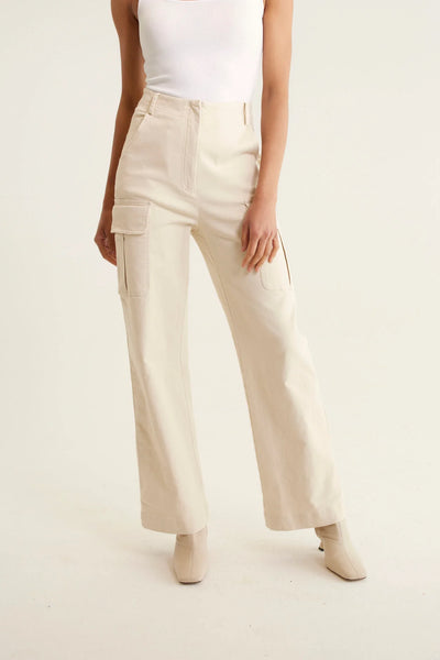 woman wearing sleeveless top in white and Whitney Cotton Drill Pant - Pebble