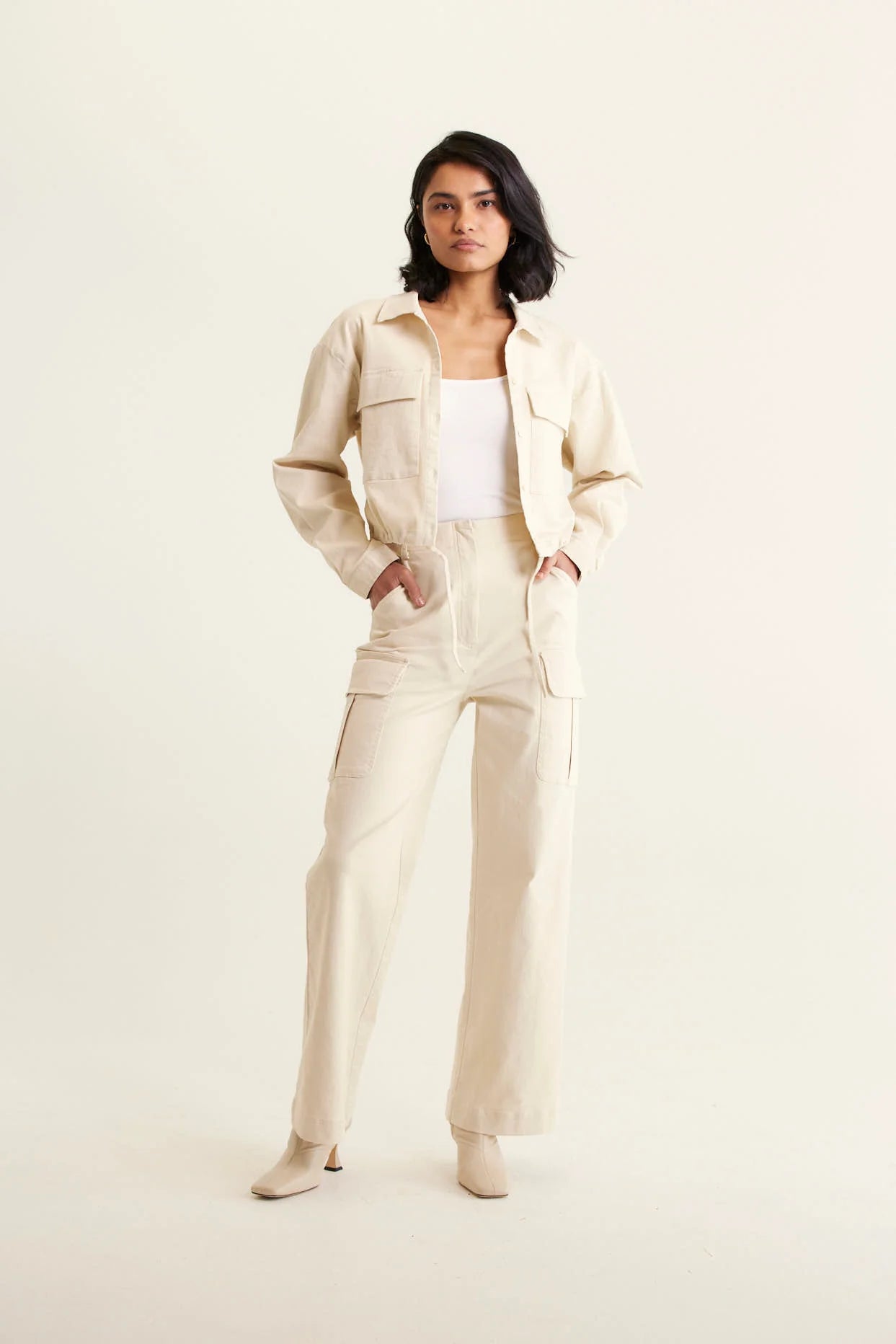 woman wearing white top, Whitney Cotton Drill Pant - Pebble and outer jacket in pebble