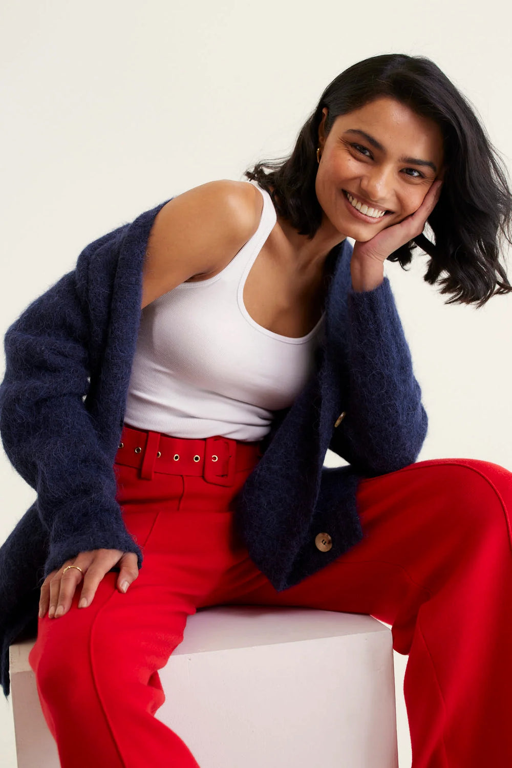 woman wearing red top and pants with Williamsburg Cardi - Navy