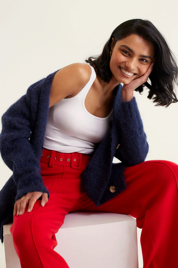 woman wearing white tank top and red pants with Williamsburg Cardi - Navy