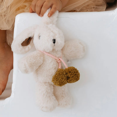 Toddler hand holding Beatrice Rabbit