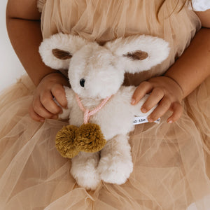 Toddler holding Beatrice Rabbit