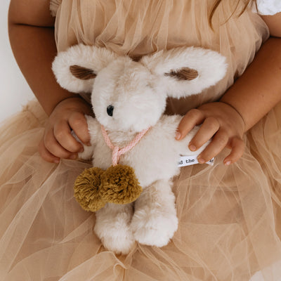 Toddler holding Beatrice Rabbit