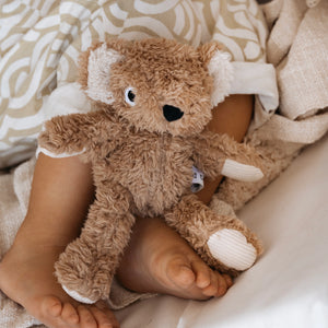 Toddler's feet with Wilbur Koala