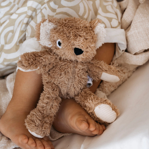 Toddler's feet with Wilbur Koala