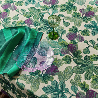 Plate of figs and a vase of flowers on a Figgy Green Round Tablecloth