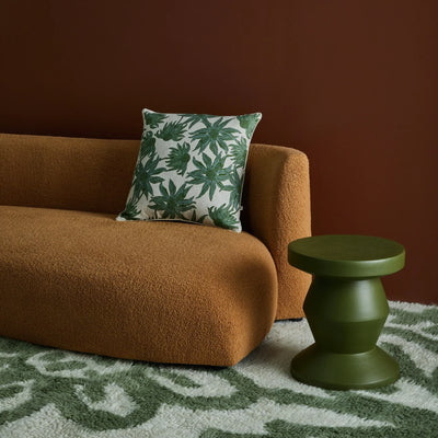 Living room with Flannel Flower Khaki 60cm Cushion placed in brown sofa 
