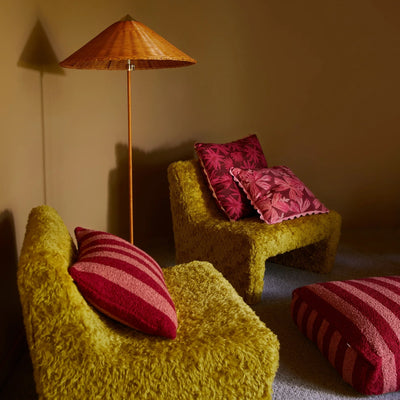 Green chair with mave rose and bold stripe cushion