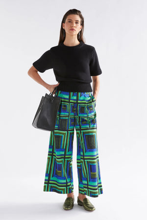 Woman wearing Black Lift Knit Top and Blue green square printed pants