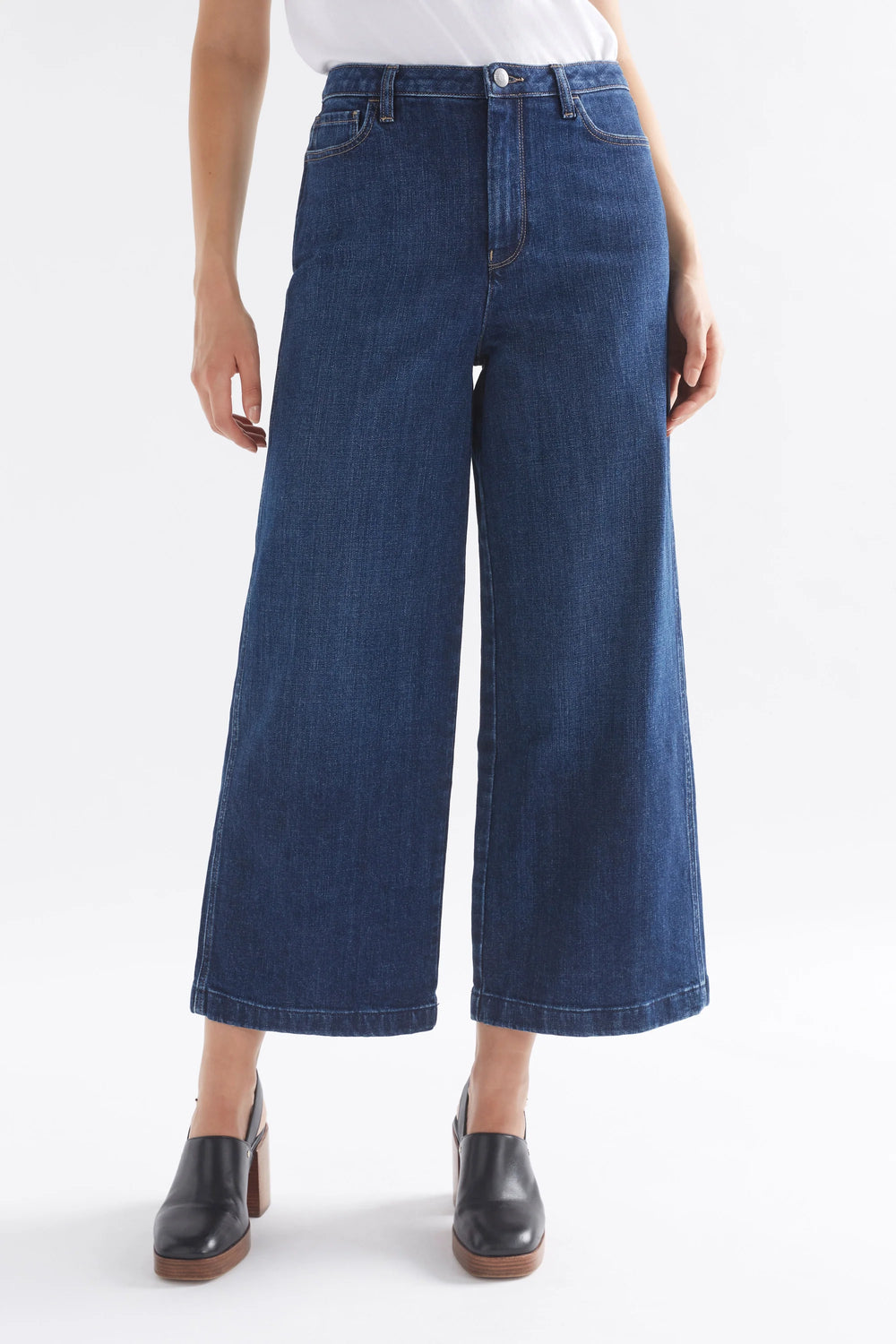 Woman wearing White top and Tovi Regen Jean Dark Blue