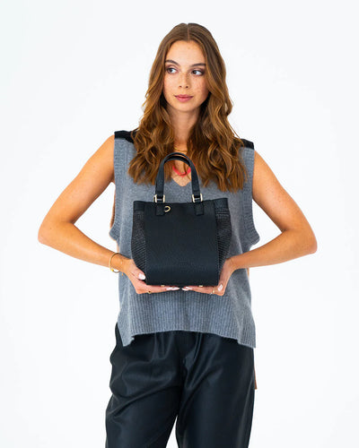 Woman holding Carnegie Tote - Black