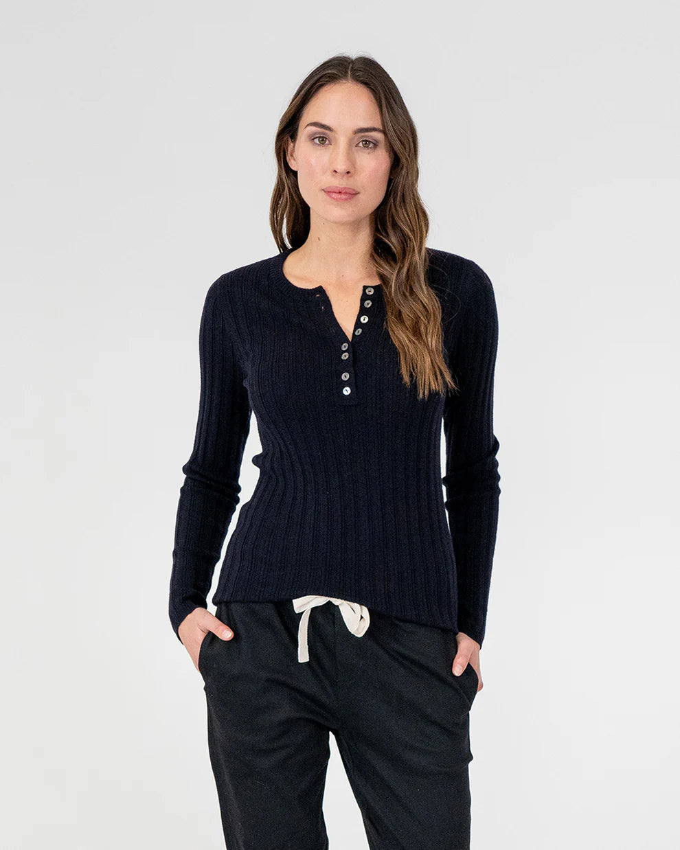 woman wearing Highton Knit Top - Navy and black bottom