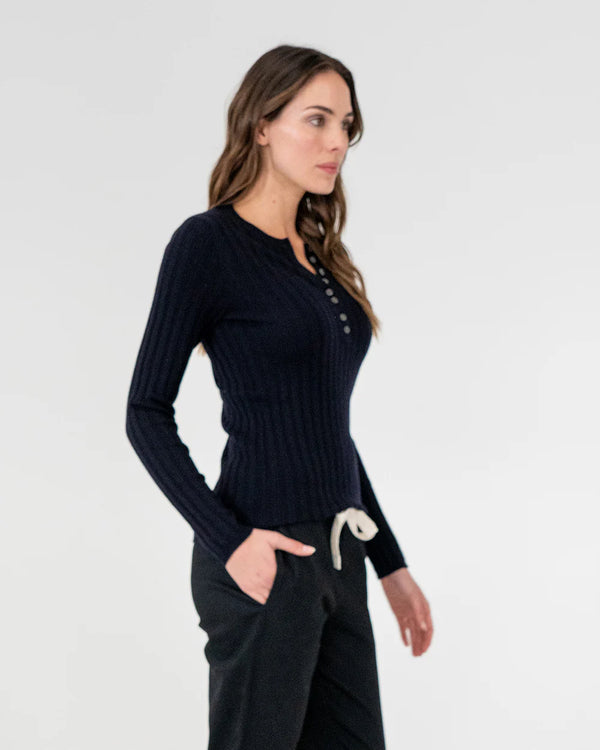 woman wearing Highton Knit Top - Navy and black bottom 