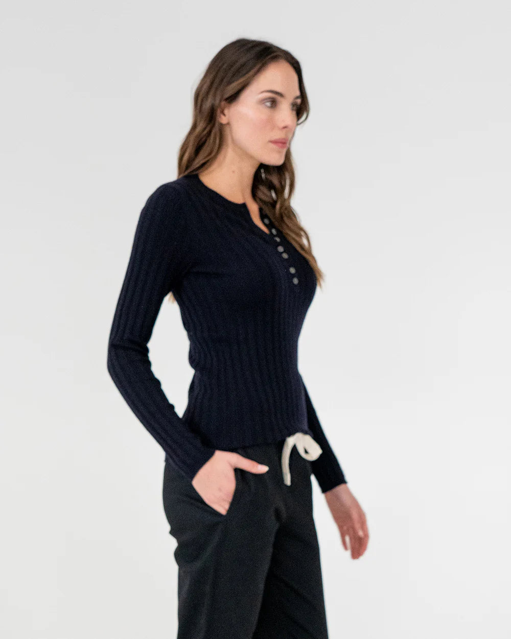 woman wearing Highton Knit Top - Navy and black bottom 