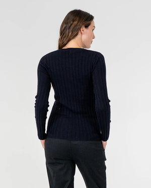 woman facing the back wearing Highton Knit Top - Navy and black bottom