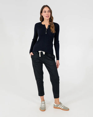 woman wearing Highton Knit Top - Navy and black bottom