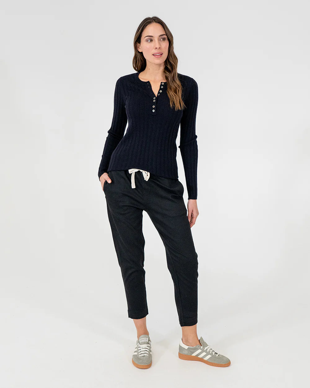 woman wearing Highton Knit Top - Navy and black bottom