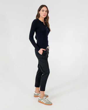 woman wearing Highton Knit Top - Navy and black bottom