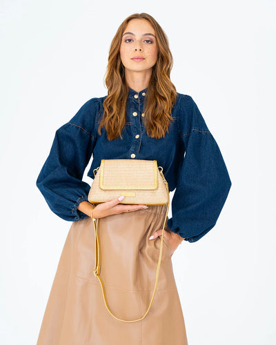 Woman holding Lugano Crossbody - Gold Weave