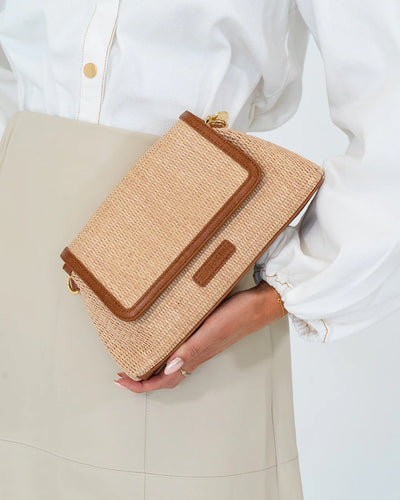woman's hand holding Lugano Crossbody - Tan Weave