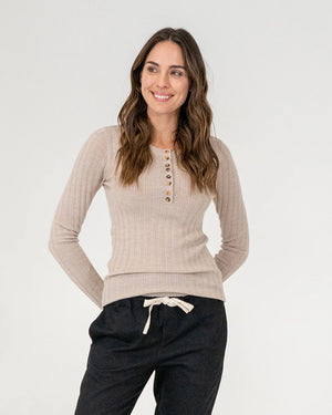 woman wearing Highton Knit Top - Natural and black bottoms