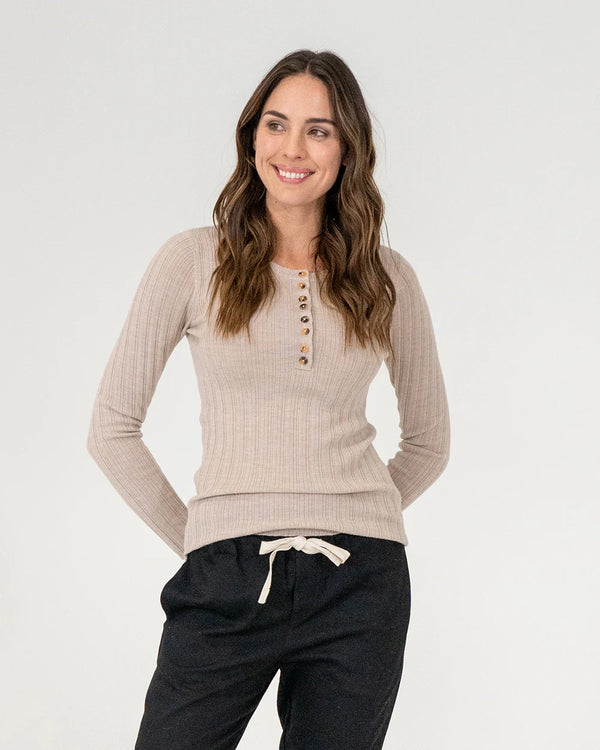woman wearing Highton Knit Top - Natural and black bottoms