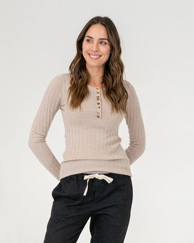 woman wearing Highton Knit Top - Natural and black bottoms
