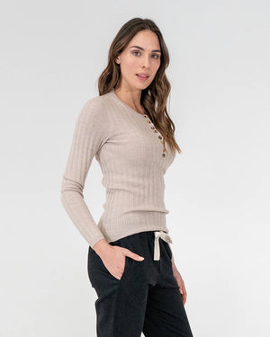woman wearing Highton Knit Top - Natural and black bottoms