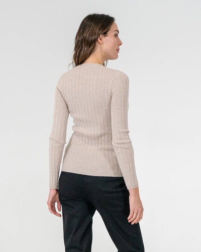 woman facing the back wearing Highton Knit Top - Natural and black bottoms