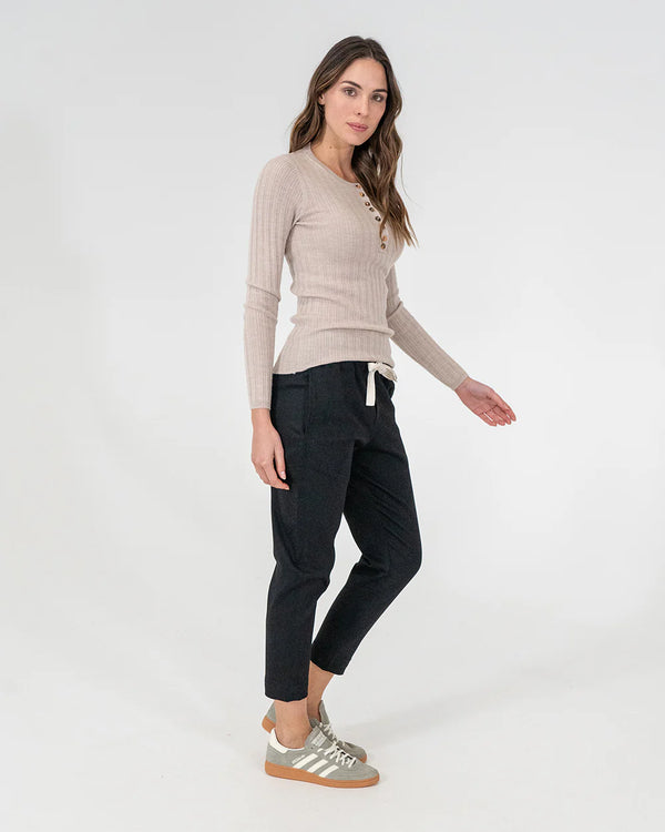 woman wearing Highton Knit Top - Natural and black bottoms