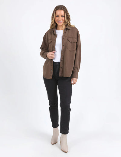Full image of woman wearing white top and black pants with Daisy Overshirt - Chocolate