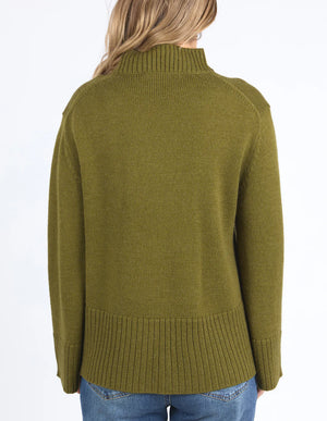 Woman facing the back Jude Knit in Olive Green