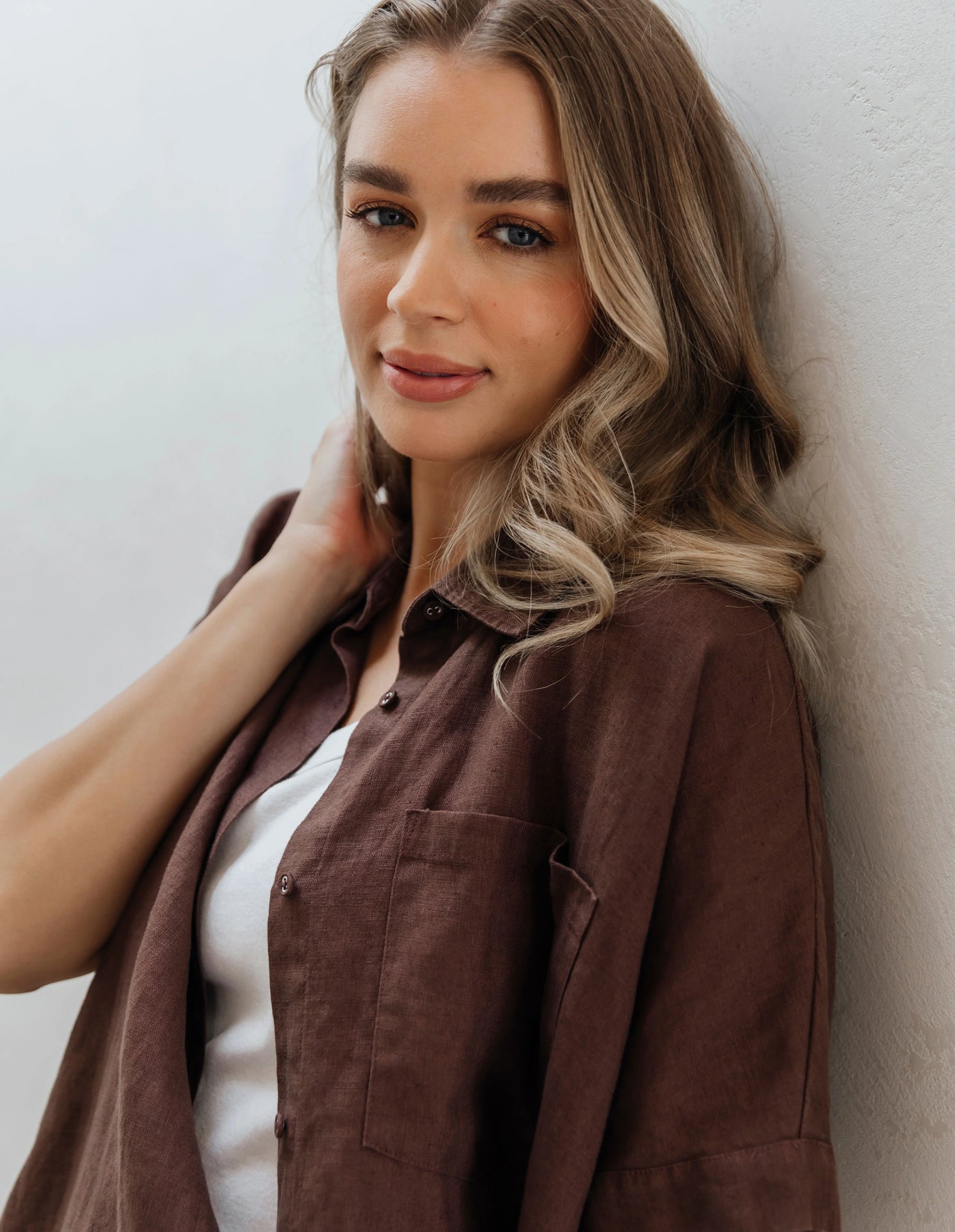 Woman wearing white inner and foxwood pierra shirt in chocolate colour