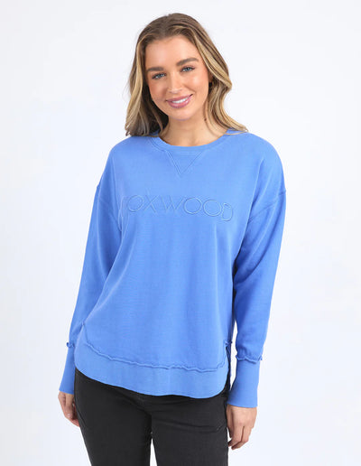 Woman wearing Simplified Crew - Cobalt and black pants