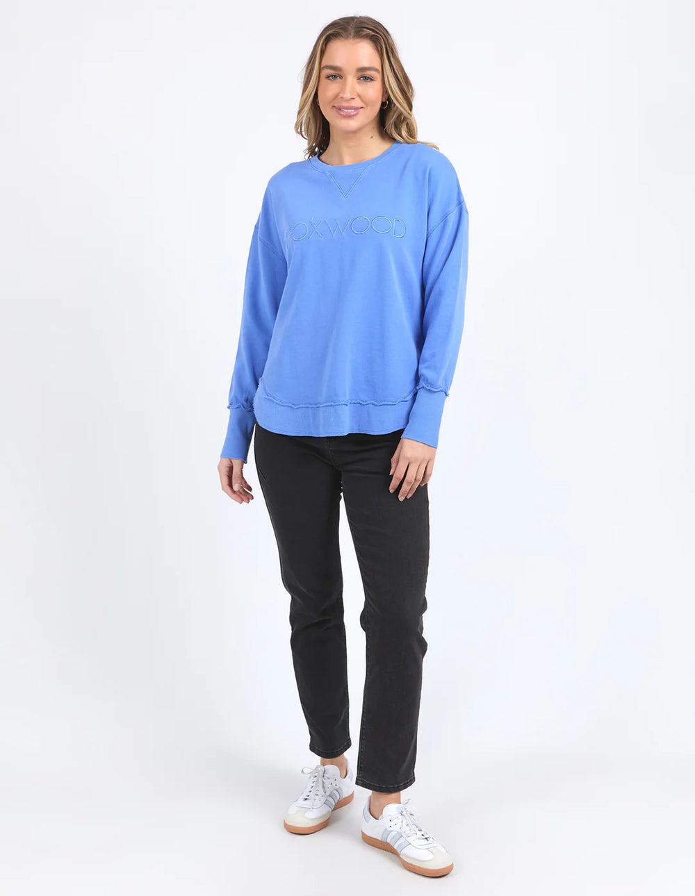 Woman wearing Simplified Crew - Cobalt and black pants