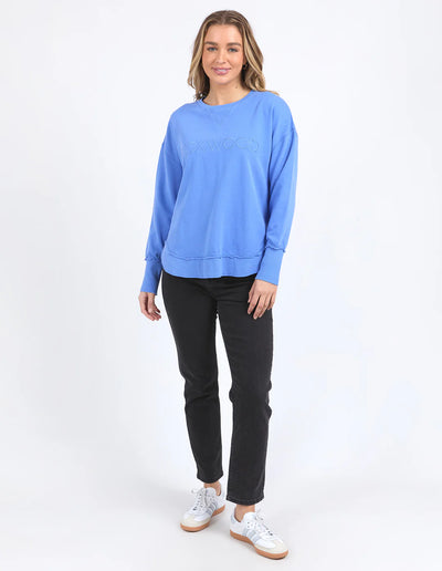 Woman wearing Simplified Crew - Cobalt and black pants