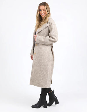 Woman slightly facing the side wearing Whistler Coat - Oat