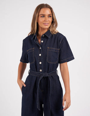 Woman wearing Lorena Jumpsuit Indigo Denim