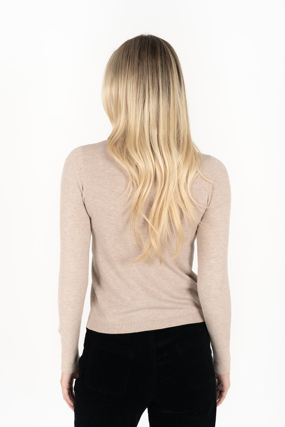 Woman wearing long sleeve Alana Skivvy in Birch and black pants