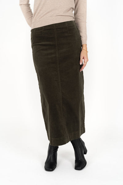 Woman wearing Tempo top in sand and Billie cord Maxi skirt in moss