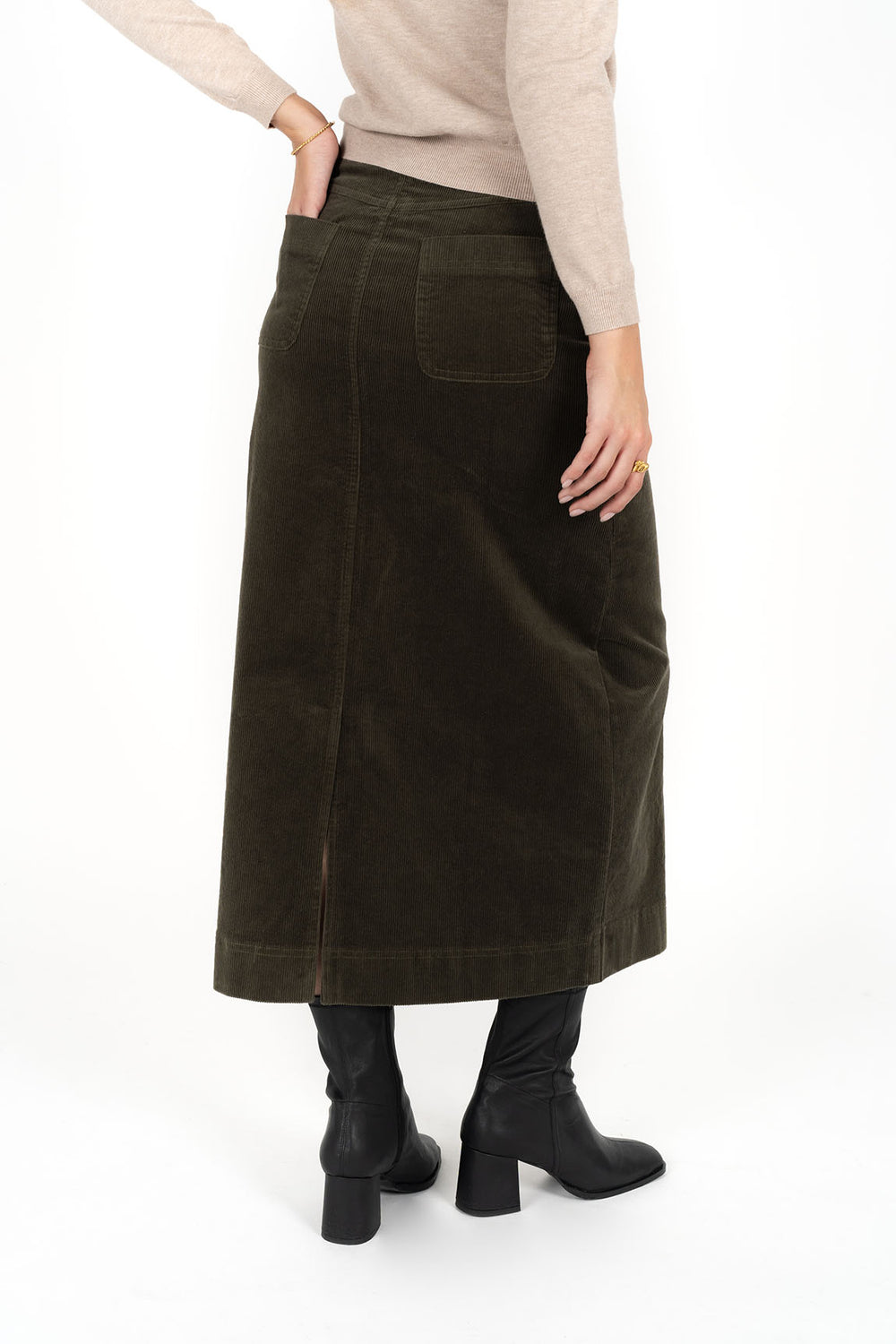 Woman wearing Tempo top in sand and Billie cord Maxi skirt in moss