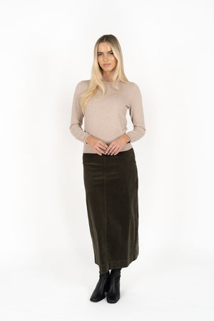 Woman wearing Tempo top in sand and Billie cord Maxi skirt in moss front view