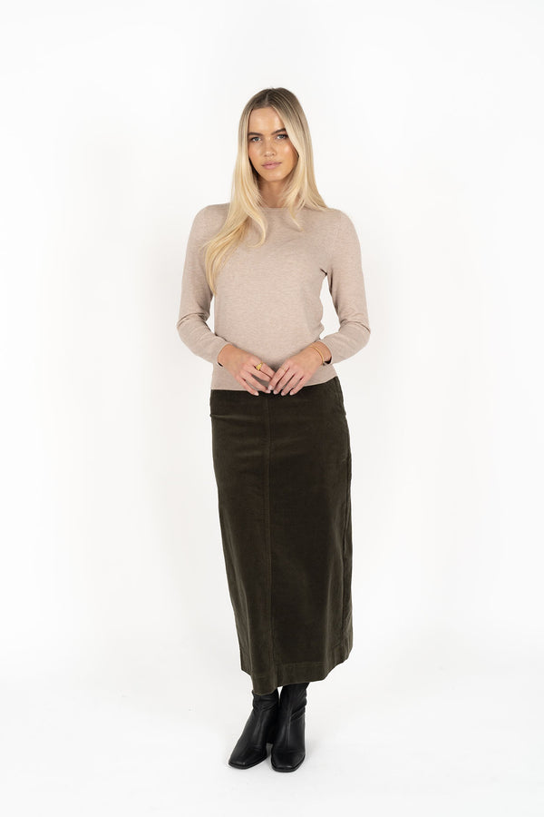 Woman wearing Tempo top in sand and Billie cord Maxi skirt in moss front view