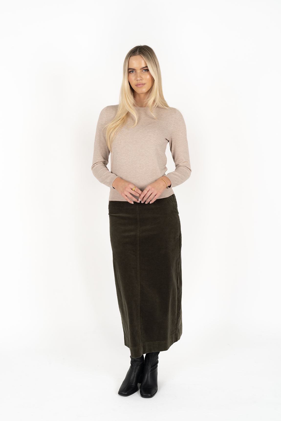 Woman wearing Tempo top in sand and Billie cord Maxi skirt in moss front view