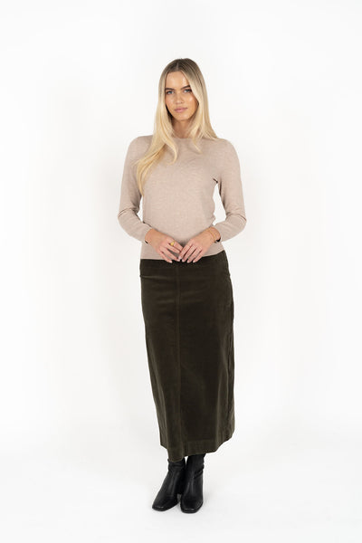 Woman wearing Tempo top in sand and Billie cord Maxi skirt in moss front view