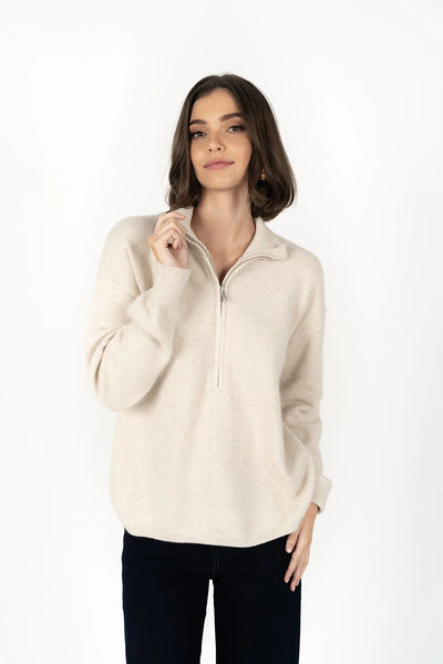Woman wearing Knox Zip Sweater - Almond and black pants