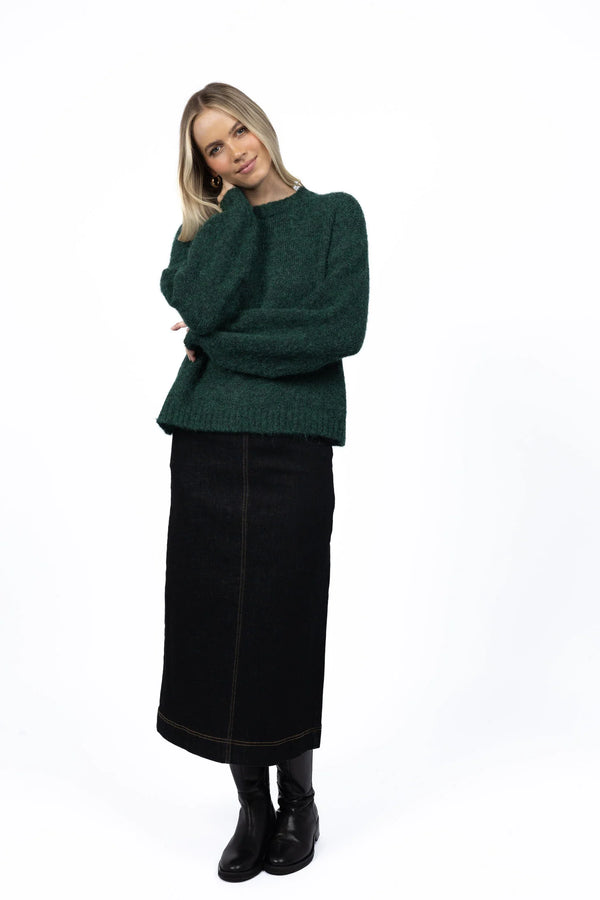 Woman wearing neve green jumper and Nevada Skirt - Black